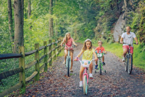family biking the Jackson River Scenic Trail